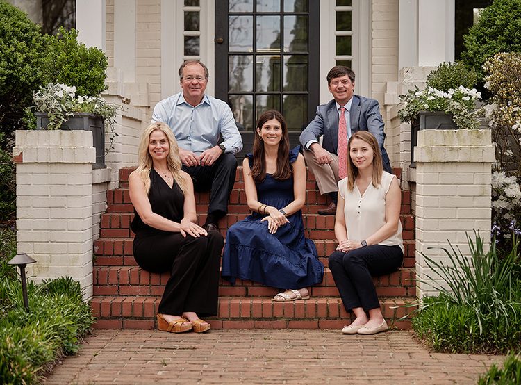 Stoever & Palmore Team Sitting on Stairsteps